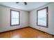 Bedroom featuring hardwood floors and natural light from the room's two windows at 7740 Us 52 Hwy, Salisbury, NC 28146