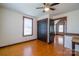 Bedroom featuring hardwood floors, ceiling fan, closet, and an attached room at 7740 Us 52 Hwy, Salisbury, NC 28146