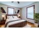 Cozy bedroom with natural light, wood trim windows, neutral tones, and hardwood floors at 7740 Us 52 Hwy, Salisbury, NC 28146