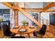 Dining room with wooden table and stairs leading to an upper level above the chairs at 7740 Us 52 Hwy, Salisbury, NC 28146