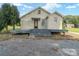 Rear of house featuring deck, gravel, and green grass at 7740 Us 52 Hwy, Salisbury, NC 28146