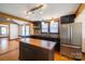 Kitchen featuring stainless steel appliances, dark wood cabinets, and butcher block countertops at 7740 Us 52 Hwy, Salisbury, NC 28146