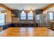 Rustic kitchen featuring dark cabinets, stainless steel refrigerator, and butcher block island at 7740 Us 52 Hwy, Salisbury, NC 28146