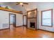 Living room features hardwood floors, a decorative fireplace, and exposed beam architecture at 7740 Us 52 Hwy, Salisbury, NC 28146