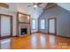 Cozy living room with high ceilings, wood floors, decorative fireplace, and lots of natural light at 7740 Us 52 Hwy, Salisbury, NC 28146