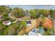 An aerial view of a newly built home near a lake surrounded by mature trees and colorful foliage at 9615 Riviera Dr, Sherrills Ford, NC 28673