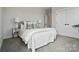 Bedroom featuring neutral tones with carpet flooring, a comfortable bed, and modern lamps at 9615 Riviera Dr, Sherrills Ford, NC 28673