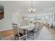 Bright dining room leads into the living room with a view of the outside through large windows at 9615 Riviera Dr, Sherrills Ford, NC 28673