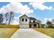 Charming new construction home with a two-car garage and a large driveway and a beautiful cloudscape at 9615 Riviera Dr, Sherrills Ford, NC 28673