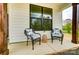 Cozy front porch with comfortable seating, offering a welcoming spot to relax and enjoy the outdoors at 9615 Riviera Dr, Sherrills Ford, NC 28673