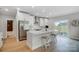 Bright kitchen with white cabinets, stainless steel appliances, and a center island with seating at 9615 Riviera Dr, Sherrills Ford, NC 28673