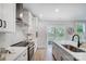 Modern kitchen with stainless steel appliances, bright white countertops, and an exterior view at 9615 Riviera Dr, Sherrills Ford, NC 28673
