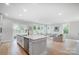 Open floor plan featuring a kitchen island with barstool seating and a view into the living room at 9615 Riviera Dr, Sherrills Ford, NC 28673