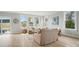 Bright living room with neutral color palette, large windows and beautiful natural light throughout the room at 9615 Riviera Dr, Sherrills Ford, NC 28673