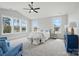 Bright primary bedroom with large windows, vaulted ceilings, soft carpet, and designer furnishings at 9615 Riviera Dr, Sherrills Ford, NC 28673