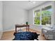Sunlit home office with a natural view, hardwood floors, and sleek modern furniture at 9615 Riviera Dr, Sherrills Ford, NC 28673