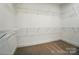 Large walk-in closet with carpet and built-in wire shelving for ample storage at 9615 Riviera Dr, Sherrills Ford, NC 28673