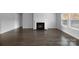 Bright living room with a fireplace, sleek hardwood floors, and recessed lights at 9819 Festival Way, Charlotte, NC 28215