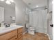 Bright bathroom featuring a vanity with solid surface counters and shower with white shower curtain at 9823 Shearwater Nw Ave, Concord, NC 28027