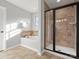 Bathroom featuring a bathtub and a glass-enclosed shower at 9823 Shearwater Nw Ave, Concord, NC 28027