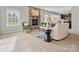 Bright and airy living room with fireplace, recessed lights, and comfortable seating at 9823 Shearwater Nw Ave, Concord, NC 28027