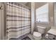 Cozy bathroom featuring shower with curtain, a neutral color scheme, and modern fixtures at 10390 Tintinhull Dr, Indian Land, SC 29707