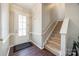 Welcoming entryway featuring wood flooring and a staircase leading to the second floor at 10390 Tintinhull Dr, Indian Land, SC 29707