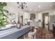 Open-concept kitchen and dining area with white cabinets and stainless steel appliances at 10390 Tintinhull Dr, Indian Land, SC 29707