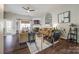 Bright and airy living room featuring modern decor, hardwood floors, and a cozy fireplace at 10390 Tintinhull Dr, Indian Land, SC 29707