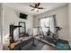 Bright workout room with fitness equipment, including a treadmill, exercise bike, and weight-lifting station at 10390 Tintinhull Dr, Indian Land, SC 29707