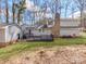 Backyard showcasing a deck, lawn, and exterior view of the home at 107 Rutledge Rd, Mount Holly, NC 28120