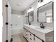 Modern bathroom featuring a double vanity with sleek black fixtures and a shower-tub combination at 107 Rutledge Rd, Mount Holly, NC 28120