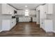 Modern kitchen featuring white cabinets, stainless steel appliances, and sleek countertops at 107 Rutledge Rd, Mount Holly, NC 28120