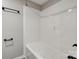 A bathroom featuring a towel rack and shower-tub combination with white finishes and wood-look flooring at 108 Spiral Ln, Shelby, NC 28152