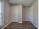 Bedroom featuring hardwood floors, closet doors, and neutral walls at 108 Spiral Ln, Shelby, NC 28152