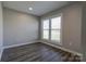 Bright bedroom featuring wood-look floors and natural light from a double window at 108 Spiral Ln, Shelby, NC 28152