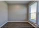 Neutral bedroom with hardwood floors and a large window at 108 Spiral Ln, Shelby, NC 28152