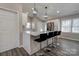 Kitchen island with bar seating, modern fixtures, and stainless steel appliances at 108 Spiral Ln, Shelby, NC 28152