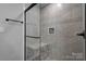 Modern tile shower with glass enclosure and a built-in tiled bench at 108 Spiral Ln, Shelby, NC 28152