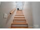 Staircase with wood and white risers and banister at 108 Spiral Ln, Shelby, NC 28152