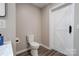 View of the toilet room featuring a door and a wood-look floor at 108 Spiral Ln, Shelby, NC 28152