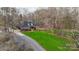 Aerial view of the brick home with large lawn and paved driveways at 1135 Ben Black Rd, Midland, NC 28107