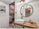 Stylish bathroom with a stone shower, modern vanity, and elegant lighting fixtures at 1135 Ben Black Rd, Midland, NC 28107