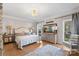 A light and airy bedroom featuring hardwood floors, a neutral color scheme, and a sitting area by the window at 1135 Ben Black Rd, Midland, NC 28107