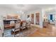 Bright dining room features hardwood floors, decorative doors, and chandelier at 1135 Ben Black Rd, Midland, NC 28107