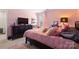 Pink bedroom with a bed, a dresser, and a window at 124 Sequoia Forest Dr, Mooresville, NC 28117