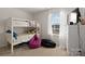 Clean bedroom with a bunk bed, a window, and storage at 124 Sequoia Forest Dr, Mooresville, NC 28117