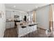 Bright kitchen with granite island, stainless steel appliances, and ample cabinet space at 124 Sequoia Forest Dr, Mooresville, NC 28117