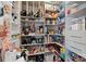 Well-organized walk-in pantry with shelving for ample storage of food and kitchen essentials at 124 Sequoia Forest Dr, Mooresville, NC 28117