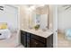 A beautifully tiled bathroom features double sinks and a doorway to another room at 130 Monteray Oaks Cir, Fort Mill, SC 29715